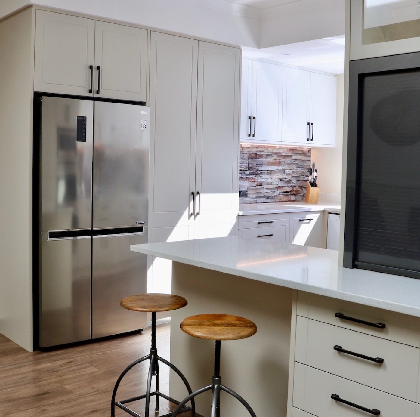 Studio 28 Interio Design Wellington Zealand. Creating wow interiors that are easy on the eye. Kitchen showing fridge, cabinetry and digital printed glass splashback