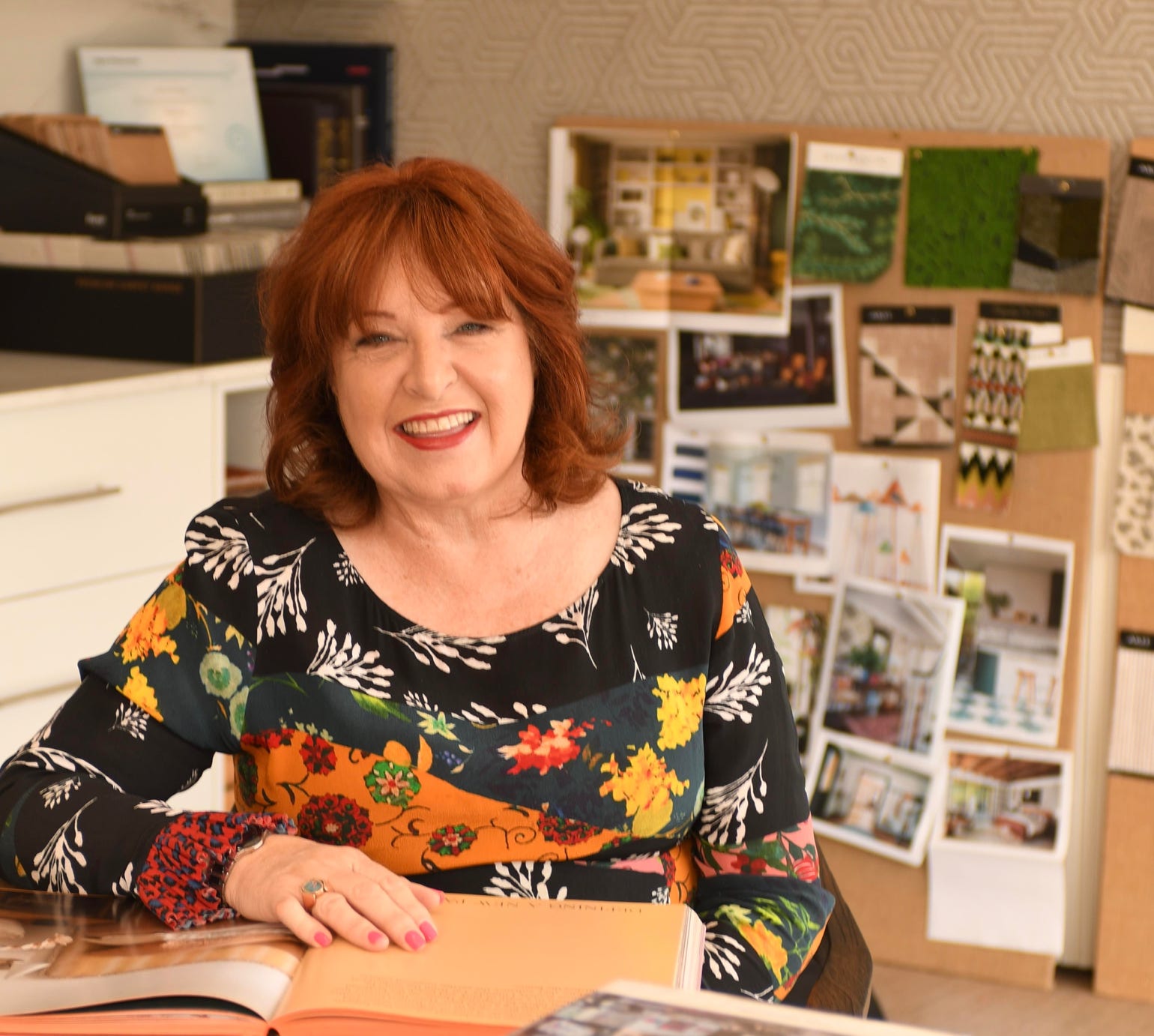 Studio 28 Interio Design Wellington Zealand. Creating wow interiors that are easy on the eye. Karyn Hopper sitting at table in interior design studio.